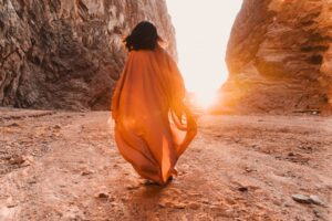 Woman walking at sunset